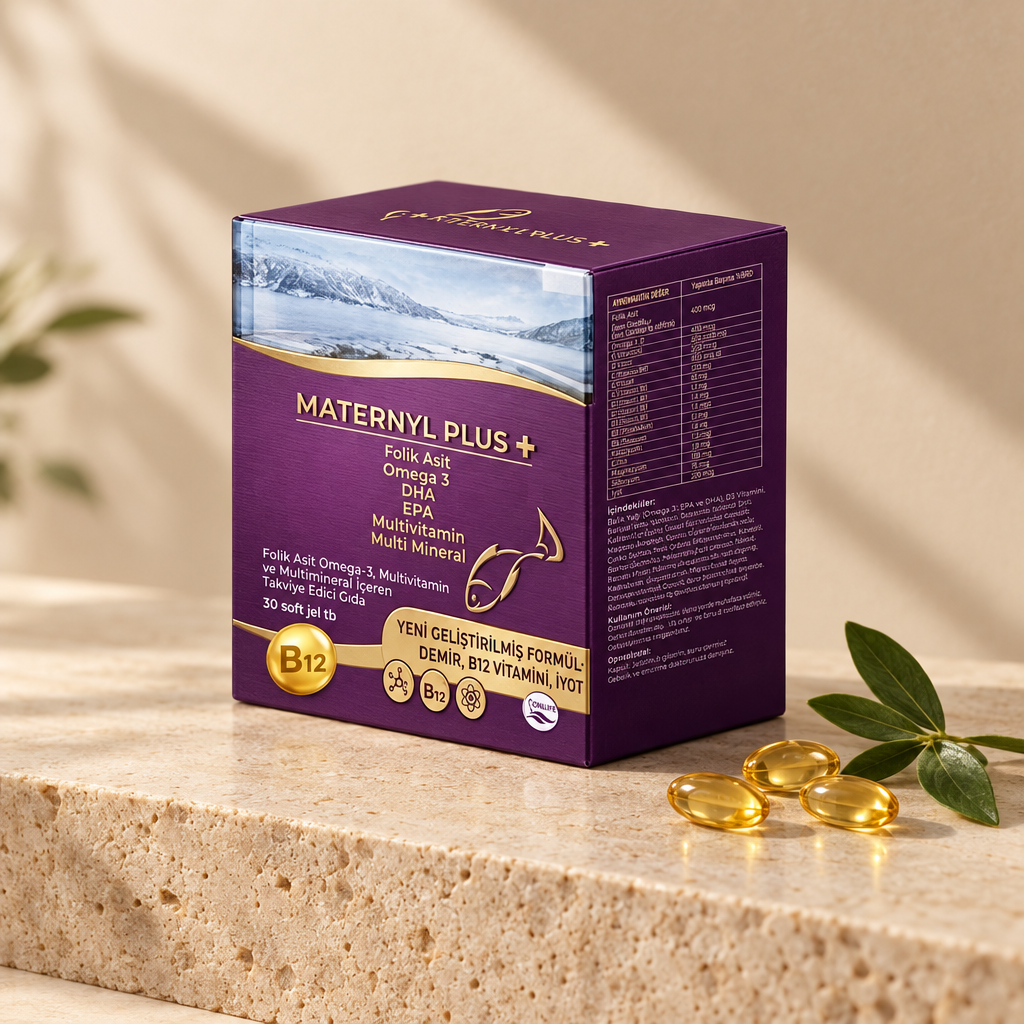Maternyl Plus 30 soft gel tablet kutusu, bej stüdyo zemininde soft gel kapsüller ve yeşil yaprakla